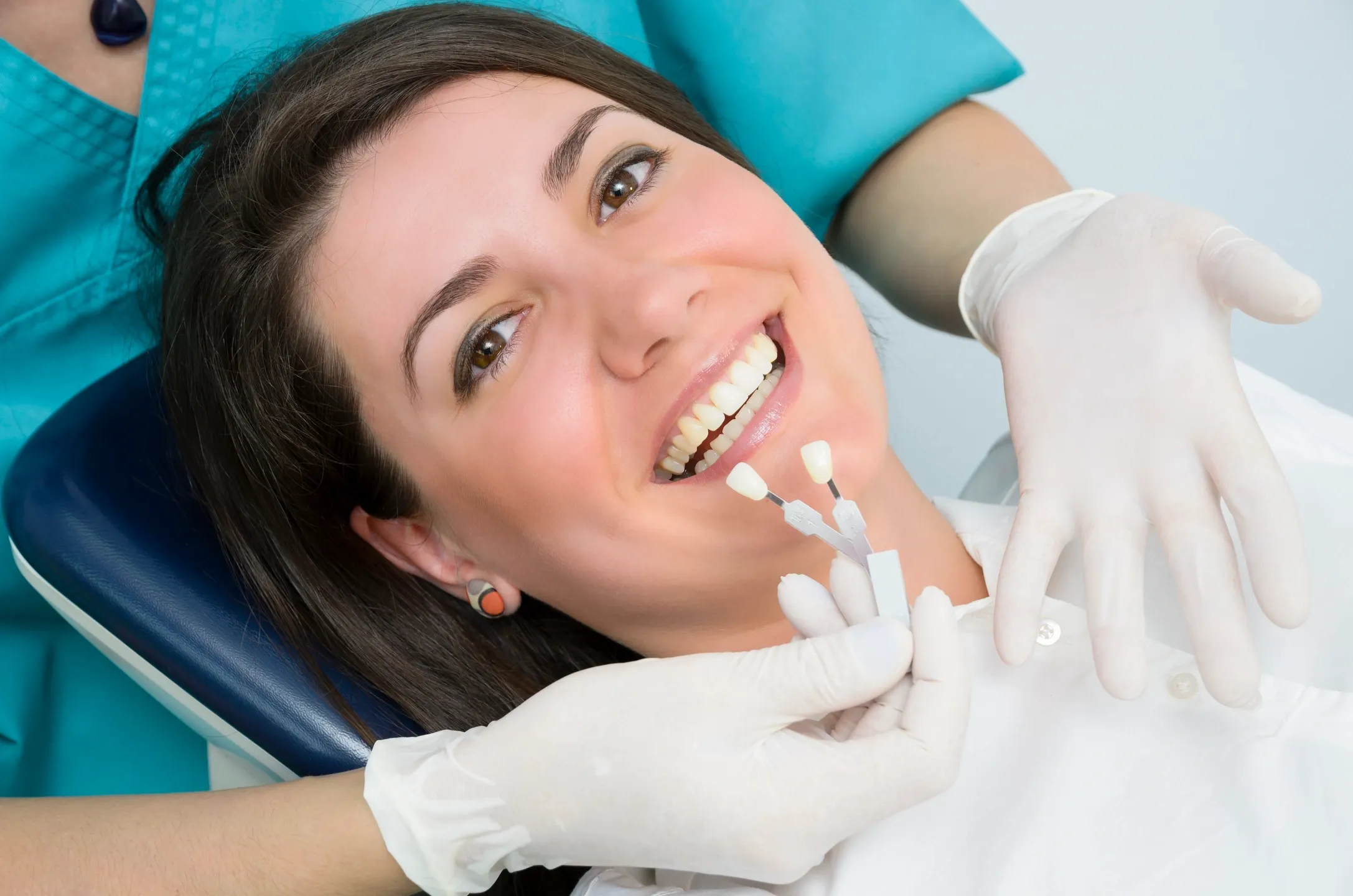 Patient receiving a teeth-whitening shade match